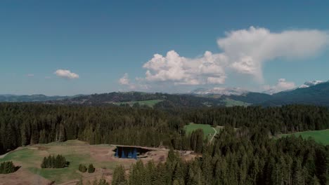 Aerial-of-Lakes,-Forests-and-Mountains-in-rural-Switzerland