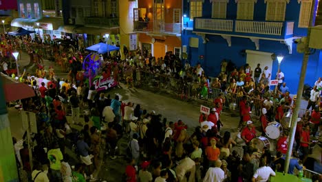 Establish-pan-from-street-art-to-drummers-in-grand-parade-at-night-for-Carnival-celebration