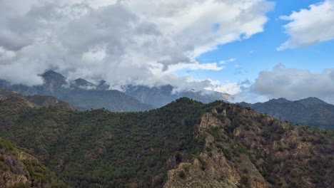 Mountain-range-timelapse-near-the-beautiful-city-of-Frigiliana-in-the-Malaga-region-with-fast-moving-clouds,-Spain