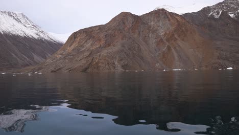 Isfjord,-Svalbard,-Norway,-Panoramic-View-of-Cold-North-Sea-Water-and-Snow-Capped-Hills-on-Coastline