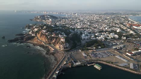 Panoramic-cityscape-aerial-drone-fly-Mazatlan-town-Mexico-pacific-ocean-skyline-Mexican-summer-city-travel-cliff-and-coastline-at-Latin-American-beach