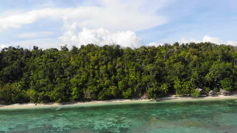 Drone-ascending-view-over-tropical-exotic-beach-of-Kri-island-in-Indonesia