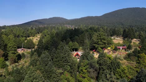 Aerial-view-dronie-cabin-inside-the-forest-tourism-la-Marquesa-Mexico