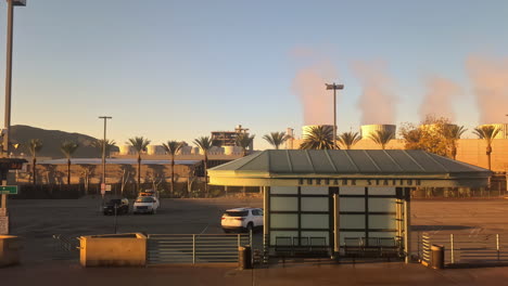 Industrial-landscape-with-towering-structures-of-refineries-emitting-polluting-gases