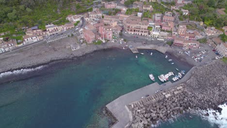 Aerial-approach-to-the-small-fishing-port-of-the-Santa-Maria-Di-Scala,-Sicily,-Italy