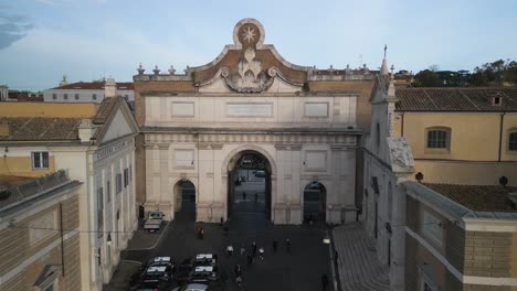 Porta-del-Popolo-in-Piazza-del-Popolo,-Forward-Drone-Shot