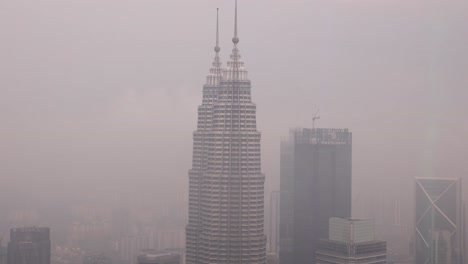 View-of-the-Petronas-Twin-Towers,-the-tallest-twin-buildings-in-the-world-in-Kuala-Lumpur,-Malaysia-skyline