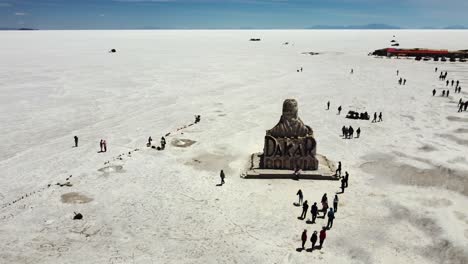 Aerial-orbits-Dakar-Monument-made-of-salt-on-Uyuni-Salt-Flat,-Bolivia