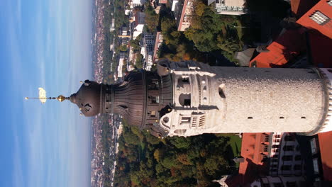 Vertical-Orbiting-Drone-Shot,-Leipzig-New-Town-Hall-Tower-and-Cityscape,-Germany