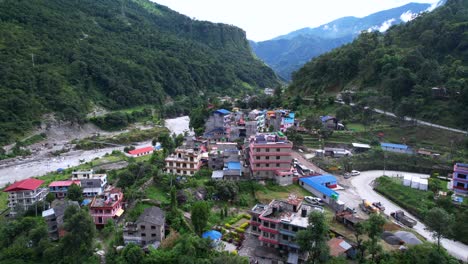 Stunning-pedestal-shot-of-the-buildings-with-green-trees-background-on-the-mountainside-in-Marpha-Village-in-Nepal