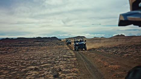 Column-of-ATV-vehicles-exploring-the-wild-volcanic-landscapes-of-Iceland