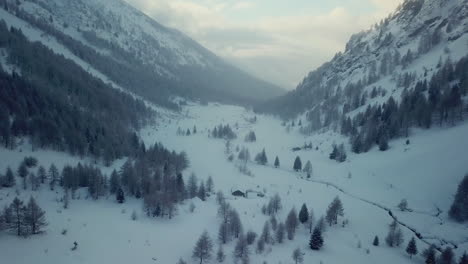 Aerial-drone-view-of-picturesque-frozen-mountainous-landscape-in-wintertime