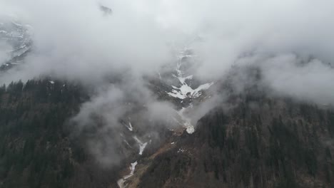 Drone-flight-over-sky-in-Klöntalersee-lake,-Glarus-Canton,-Switzerland