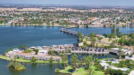 Pan-across-the-resort-houses-on-the-Mulwala-side-of-the-lake-then-past-the-road-bridge-to-the-weir-bridge