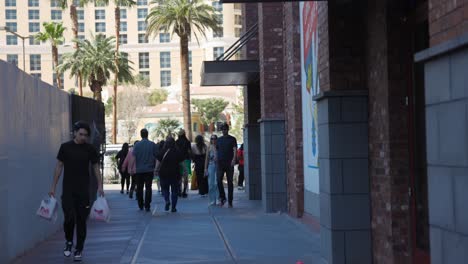 People-Walking-In-The-Street-Of-Las-Vegas-City-in-Nevada,-USA