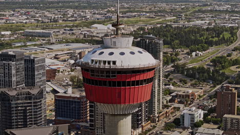 Calgary-AB-Canada-Aerial-v21-zoomed-close-up-shot-drone-fly-towards-the-landmark-observation-tower-in-downtown-core-district-against-views-of-Beltline-area---Shot-with-Mavic-3-Pro-Cine---July-2023