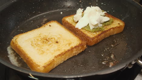 Soft-Mozzarella-cheese-added-to-thick-frying-sandwich-bread-in-pan