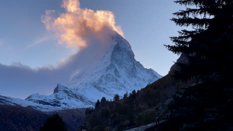 Incredible-stunning-sunset-Zermatt-town-Glacier-glacial-peaks-Swiss-Alps-famous-close-up-Toblerone-Matterhorn-summit-ski-resort-alpine-landscape-scenery-aerial-drone-autumn-Switzerland-pan-left