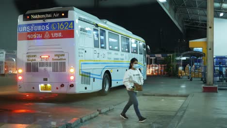 Parked-at-a-bus-terminal,-a-passenger-bus-turned-on-it-hazard-lights-as-it-is-parked-in-a-wrong-place-at-Mochit-Bus-Station-in-Thailand