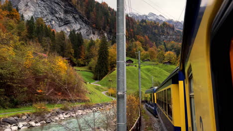 Switzerland-Swiss-Alps-train-ride-Grindelwalk-Jungfrau-Interlaken-to-Lauterbrunnen-late-October-November-autumn-fall-colors-river-late-afternoon-Bernese-Overland-Thun-Bern-region-snow-peak-glacier