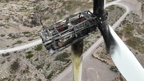 Extreme-closeup-view-of-a-wind-turbine-completely-destroyed-by-a-fire