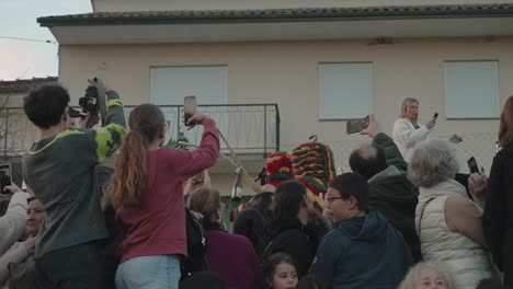 festive-gathering-in-Podence-as-onlookers-capture-the-vibrant-Caretos-performance-with-their-phones