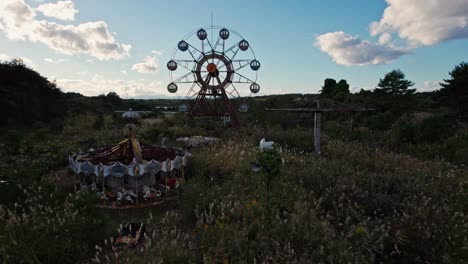 Drone-Fly-abandoned-ferris-wheel-park-Kejonuma-Leisure-land,-Japan-Countryside-green-savage-fields,-Aerial-Japanese-skyline-in-autumn-daylight,-Tōhoku-Sendai