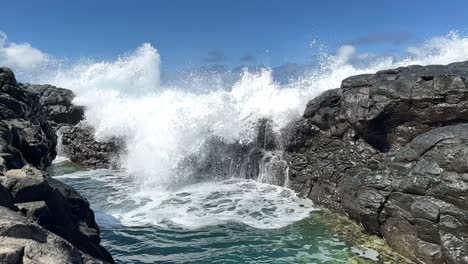 Wave-hit-coral-reef-toward-natural-pool,-Pacific-Ocean,-slow-motion