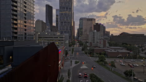 Calgary-AB-Canada-Aerial-v57-perspective-view-drone-flyover-Downtown-Commercial-above-5-Ave-SW-capturing-cityscape-with-towering-skyscrapers-and-sunset-sky---Shot-with-Mavic-3-Pro-Cine---July-2023