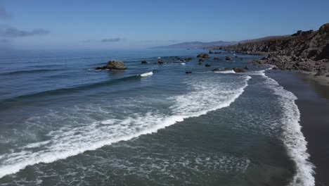 4k-Aerial-Drone-Footage-over-Beach-Waves-in-Northern-California-Blue-Skies