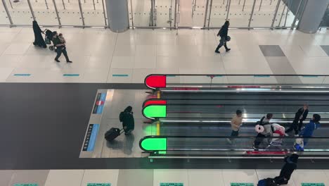 People-Walking-and-Using-Travelator-at-Airport