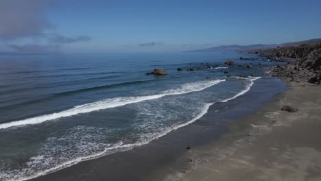 4K-Aerial-Drone-Footage-Over-Waves-on-a-Sandy-Beach-in-Northern-California-on-a-Sunny-Day