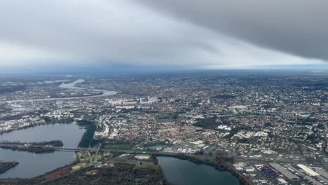 Aerial-view-of-Bordeaux-city,-France,-shot-from-a-jet-cockpit-in-a-rainny-winter-morning
