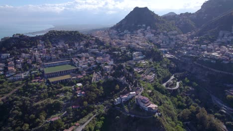 Aerial-approach-to-the-Taormina,-Sicily,-Italy-from-the-north-side