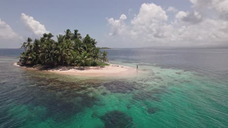 Drone-clip-in-San-Blas-Islands-with-a-person-walking-in-a-remote-Island