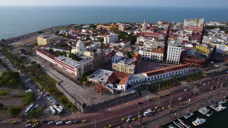 Aerial-View-of-Cartagena,-Colombia,-Old-Colonial-Town-Buildings-and-Traffic,-Drone-Shot