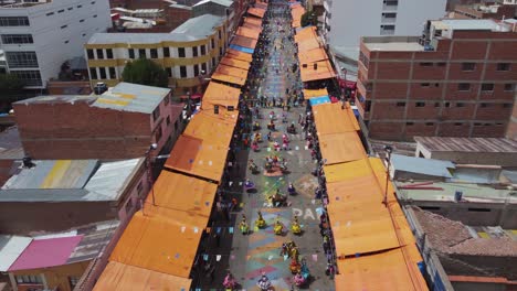 Aerial:-Colorful-costumed-carnival-participants-parade,-Oruro-Bolivia