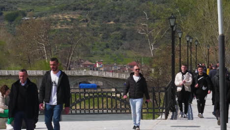 Tourists-walking-in-UNESCO-town-Berat-at-Spring,-Berat,-Albania
