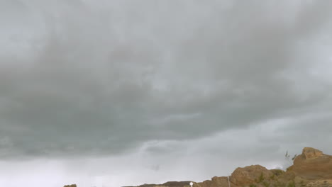 A-lightning-bolt-hits-just-in-front-of-the-camera-while-driving-through-the-desert