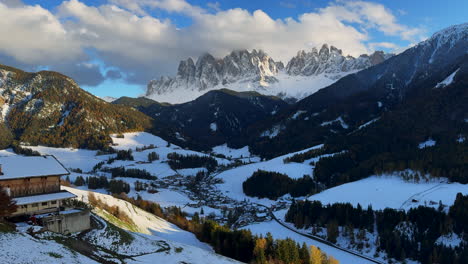 Dolomites-stunning-heavenly-golden-hour-sunset-Val-di-Funes-autumn-first-snow-Italian-Alps-mountain-village-rural-countryside-South-Tyrol-Bolzano-Province-jagged-three-peaks-Lavaredo-pan-left-motion