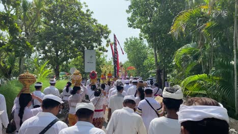 Hindu-religious-congregations-procession-to-Samuh-beach-Bali-for-the-melasti-ceremony,-ahead-of-the-silent-day-of-Nyepi
