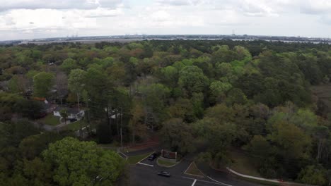 Aerial-wide-reverse-pullback-shot-of-the-Old-Charles-Town-Landing-along-the-banks-of-the-Ashley-River-at-Albermarle-Point,-South-Carolina