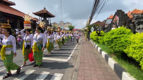 Hindu-religious-congregations-procession-to-Samuh-beach-Bali-for-the-melasti-ceremony,-ahead-of-the-silent-day-of-Nyepi