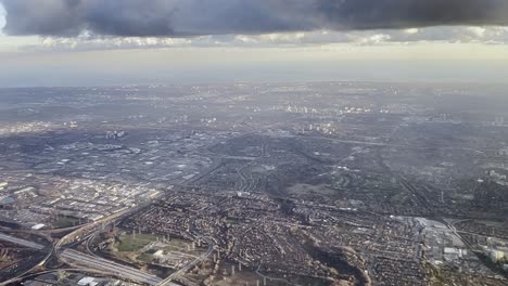 Aerial-view-of-Toronto-peripheral-area-as-seen-from-airplane-approaching-Pearson-airport,-Ontario-in-Canada