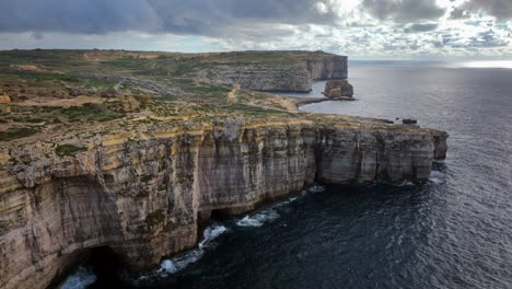Aerial-view-of-Dwejra-bay-in-Gozo,-with-a-Fungus-rock-in-the-distance