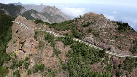 Drone-shot-of-car-driving-on-mountain