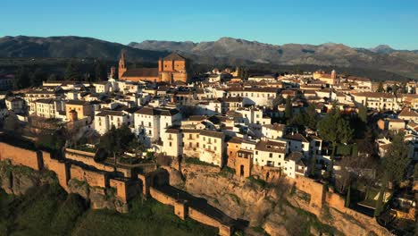 Ronda-Puente-Nuevo-Aerial-Drone-View-in-Andalusia-Spain-moorish-town-mountain-range-background,-Skyline-at-touristic-village