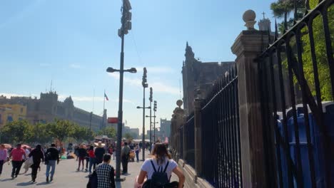 Walking-beside-Cathedral-Mexico-City,-Zocalo-Mexico-City