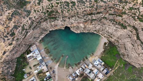 Aerial-view-of-Inland-Sea-in-Dwejra-Bay,-underwater-cave-on-the-Maltese-Island-of-Gozo,-Malta