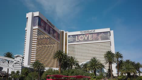 Daytime-exterior-of-The-Mirage-hotel-and-casino-in-sunny-Las-Vegas,-USA,-tilt-down